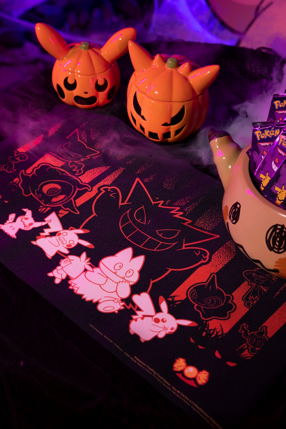 Pokemon_Center_2022_Halloween_Pokemon_TCG_Playmat_Lifestyle_Image.jpg